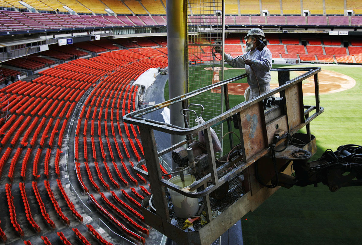 Daniel Lepe, paints a foul pole at RFK Stadium, the home field of the Washington Nationals, Tuesday, March 29, 2005, in Washington. Excitement is building for the Washington Nationals Opening Day match-up against the Philadelphia Phillies in Philadelphia next week, but fans in the DC area may not be able to see it on television. (AP Photo/Manuel Balce Ceneta)