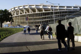 Fans walk to RFK Stadium before the start of the baseball game between the New York Mets and the Washington Nationals, Tuesday Sept. 18, 2007, in Washington. The Washington Nationals are entering their final homestand at RFK Stadium, which opened in 1961 as D.C. Stadium. RFK Stadium has also been home to the Washington Senators, the NFL's Washington Redskins and MLS D.C. United soccer team. The Nationals are moving to a new $611 million ballpark, located in Southeast Washington along the Anacostia River for opening day in April, 2008 (AP Photo/Pablo Martinez Monsivais)