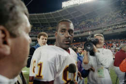 Washington Redskins wide receiver Art Monk leaves the field after Redskins 34-3 victory over the Denver Broncos at RFK Stadium in Washington, Oct. 12, 1992. Monk broke the record for career receptions in the fourth quarter when he caught his 820th pass.  (AP Photo/Wilfredo Lee)