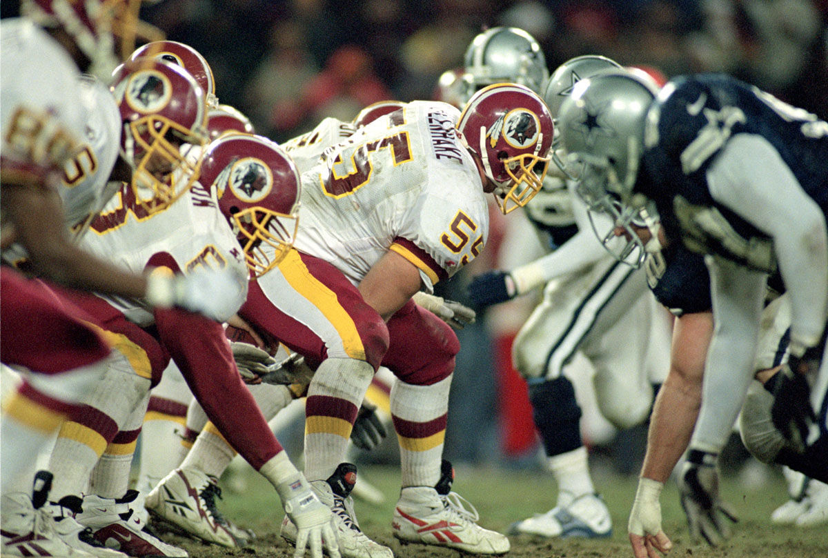 WASHINGTON - DECEMBER 22:  Center Jeff Uhlenhake #55 of the Washington Redskins snaps the ball during the NFL game against the Dallas Cowboys at RFK Stadium on December 22, 1996 in Washington, D.C.  The Redskins defeated the Cowboys 37-7.  (Photo by Doug Pensinger/Getty Images)