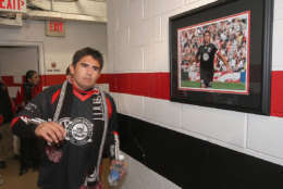 Jaime passes by his photo on the way to the last time in the locker room during festivities surrounding the final appearance of Jaime Moreno in a D.C. United uniform, at RFK Stadium, in Washington D.C. on Oct. 23, 2010. Toronto won 3-2. (Courtesy Tony Quinn)