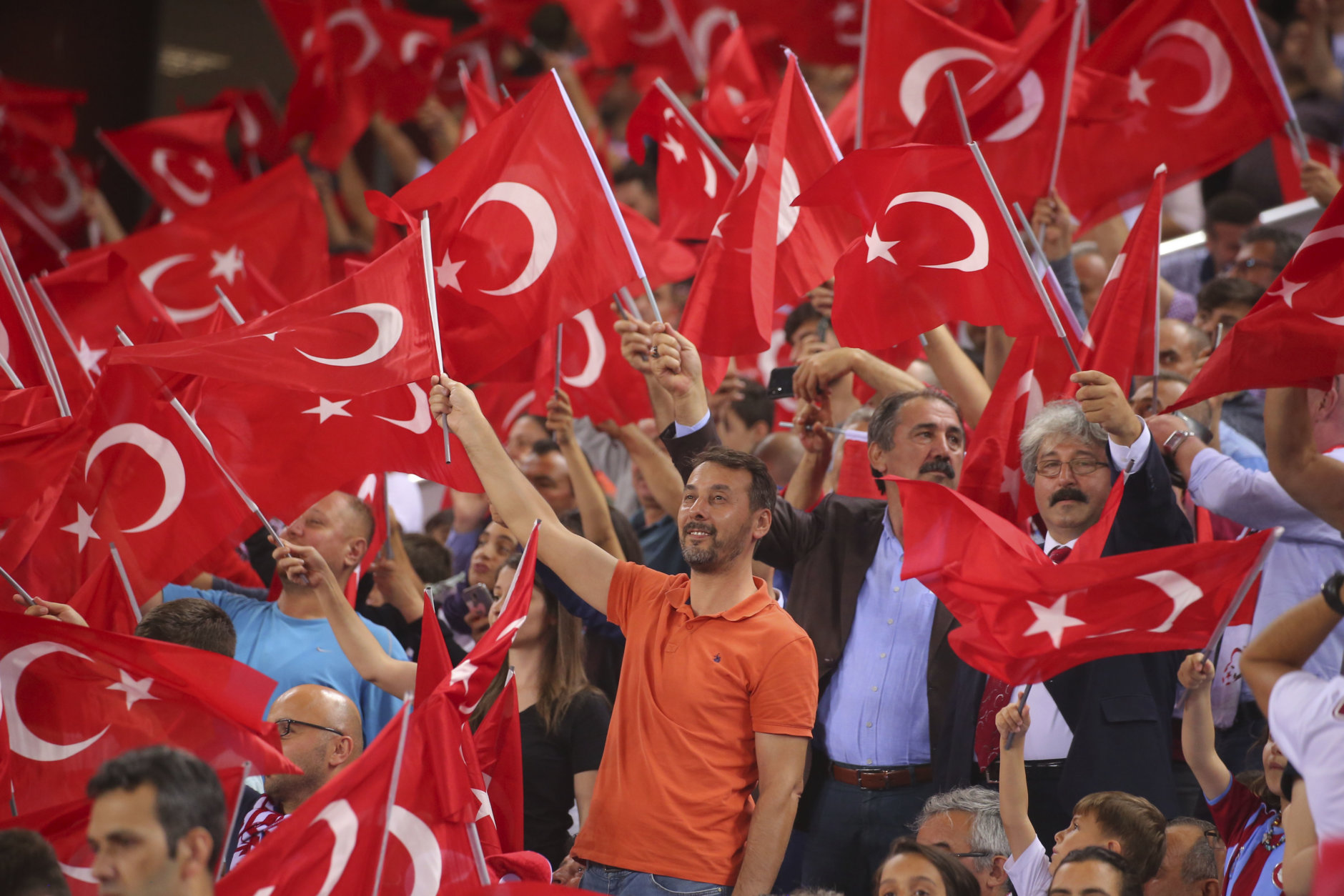 Turkey's fans wave national flags prior to the UEFA Nations League soccer match between Turkey and Russia in Trabzon, Turkey, Friday, Sept. 7, 2018. (AP Photo)
