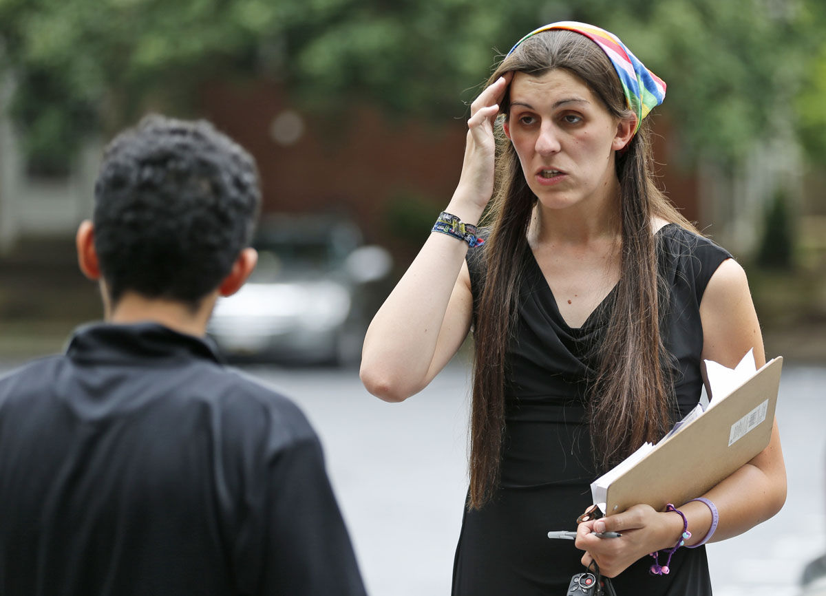 Democratic nominee for the House of Delegates 13th district seat, Danica Roem, right, talks with a resident as she greets voters at a neighborhood Wednesday, June 21, 2017, in Manassas, Va. Roem is running against Del. Bob Marshall in the 13th House of Delegates District. (AP Photo/Steve Helber)