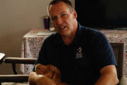 Rick Yount and puppy "Lou" after a play session. (WTOP/Kate Ryan)
