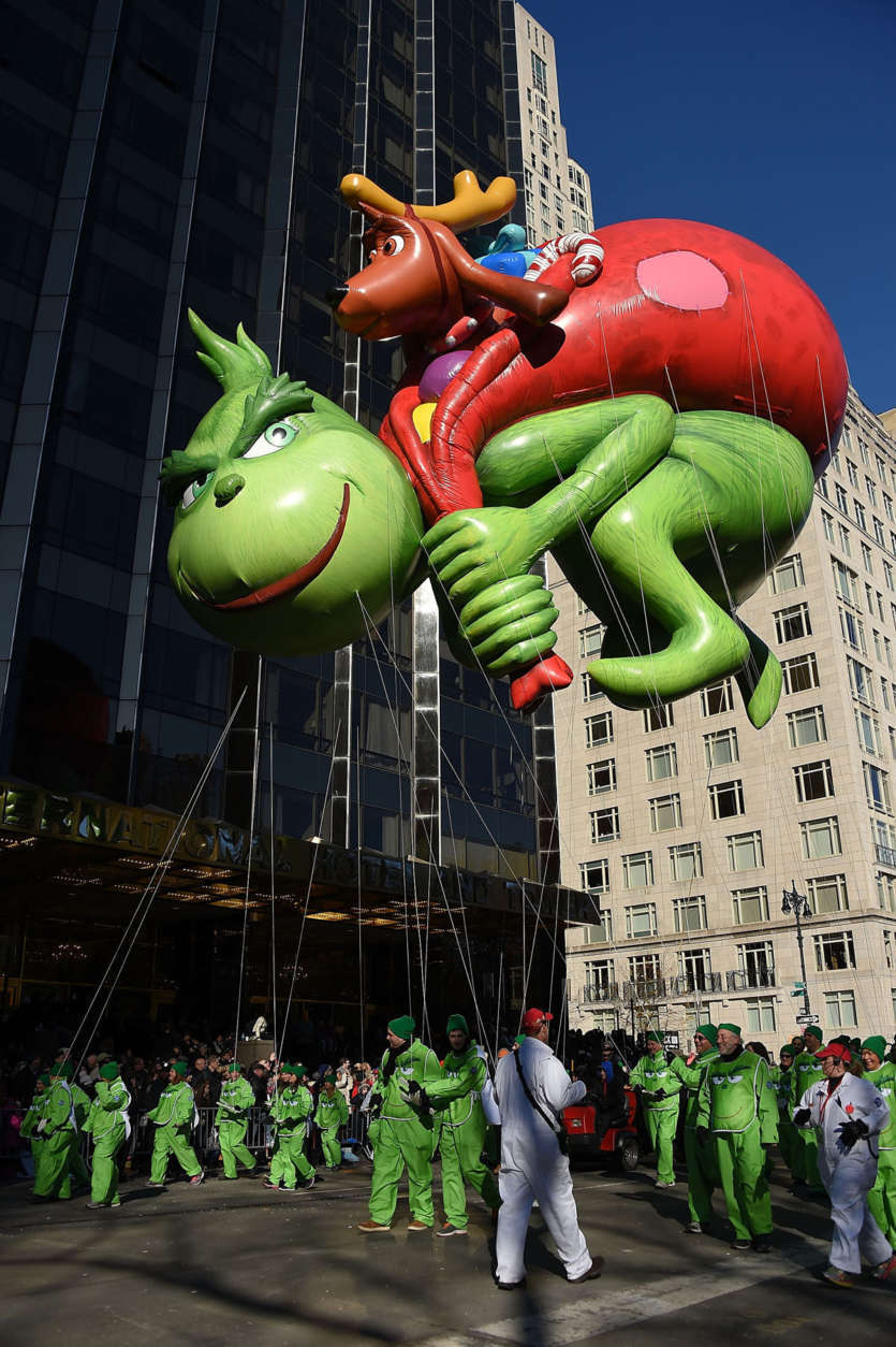 NEW YORK, NY - NOVEMBER 23:  The Dr. Seuss Grinch and Max balloon floats down Central Park West and into Columbus Circle during the 91st Annual Macy's Thanksgiving Day Parade on November 22, 2017 in New York City.  (Photo by Michael Loccisano/Getty Images)