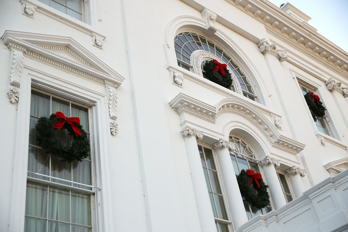 WASHINGTON, DC - NOVEMBER 27:  Christmas wreaths are seen on the windows of the White House during a press preview of the 2017 holiday decorations November 27, 2017 in Washington, DC. The theme of the White House holiday decorations this year is "Time-Honored Traditions."  (Photo by Alex Wong/Getty Images)