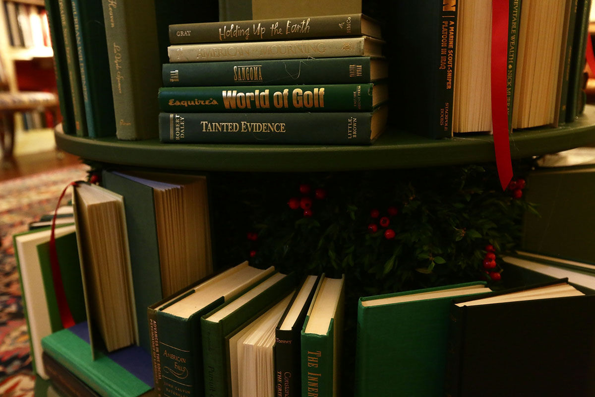 WASHINGTON, DC - NOVEMBER 27:  Detail shot of the book volumes that form a Christmas tree in the library at the White House during a press preview of the 2017 holiday decorations November 27, 2017 in Washington, DC. The theme of the White House holiday decorations this year is "Time-Honored Traditions."  (Photo by Alex Wong/Getty Images)