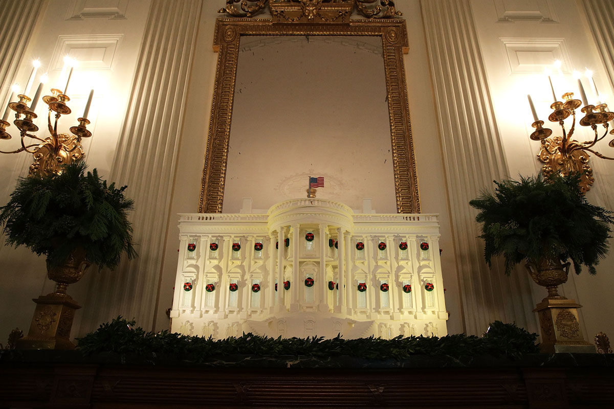 WASHINGTON, DC - NOVEMBER 27:  The White House gingerbread house is on display in the State Dining Room at the White House during a press preview of the 2017 holiday decorations November 27, 2017 in Washington, DC. The theme of the White House holiday decorations this year is "Time-Honored Traditions."  (Photo by Alex Wong/Getty Images)