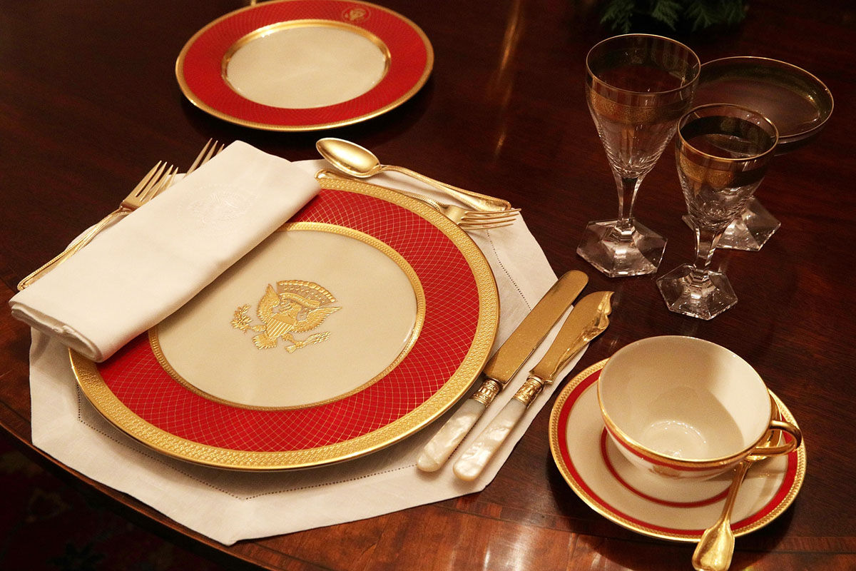 WASHINGTON, DC - NOVEMBER 27:  Place setting is seen on a dining table in the China Room at the White House during a press preview of the 2017 holiday decorations November 27, 2017 in Washington, DC. The theme of the White House holiday decorations this year is "Time-Honored Traditions."  (Photo by Alex Wong/Getty Images)