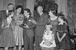 President Eisenhower poses with members of his family during a Christmas Eve picture taking session in the west sitting room of the second floor residence section of the White House in Washington on Dec. 24, 1960. From left: Lt. Col. John Eisenhower; Barbara Anne, 11, in front; Mrs. John Eisenhower, David 12, the President, Mrs. Eisenhower, Mary Jean, 5, in front, and Susan, 9. (AP Photo/Henry Griffin )