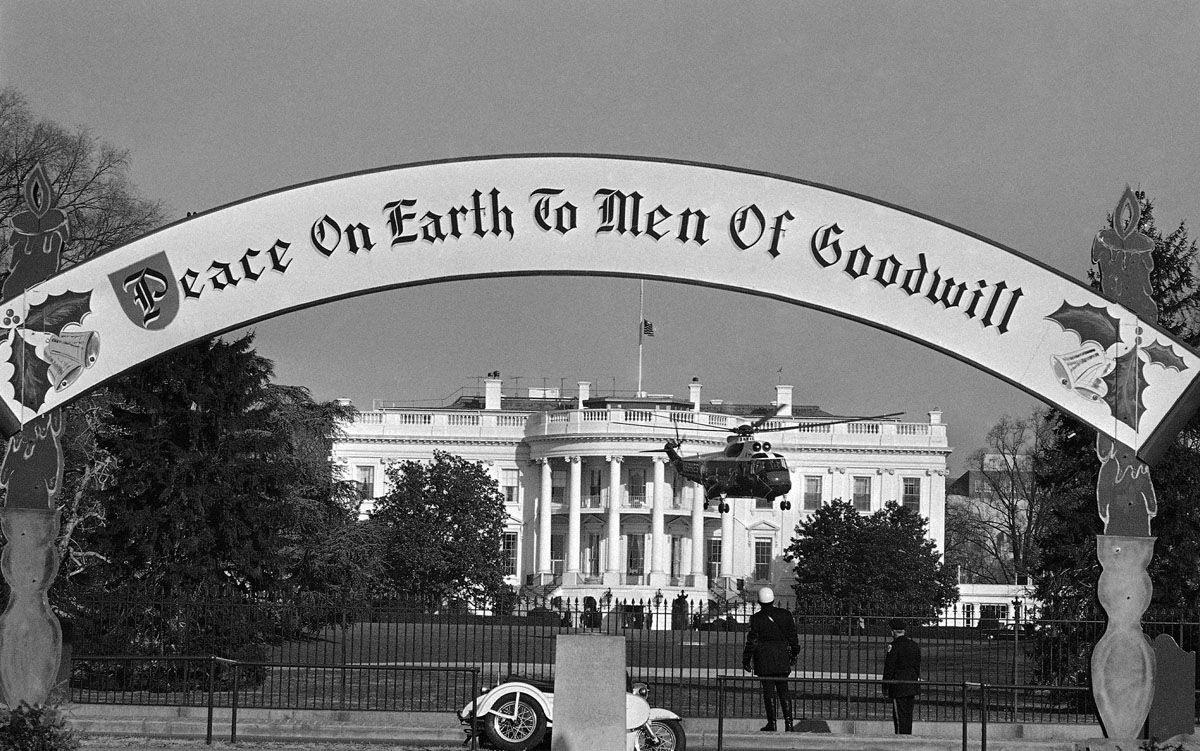 President Lyndon Johnson’s helicopter raises off the White House South grounds in Washington, as he departs for New York and a speech before the United Nations on Dec. 17, 1963. Sign framing the scene is at gate to capital’s annual Christmas Pageant of Peace on the Ellipse. Flag over executive mansion flies at half-state during last days of national mourning over the death of President Kennedy. (AP Photo/Henry Burroughs)