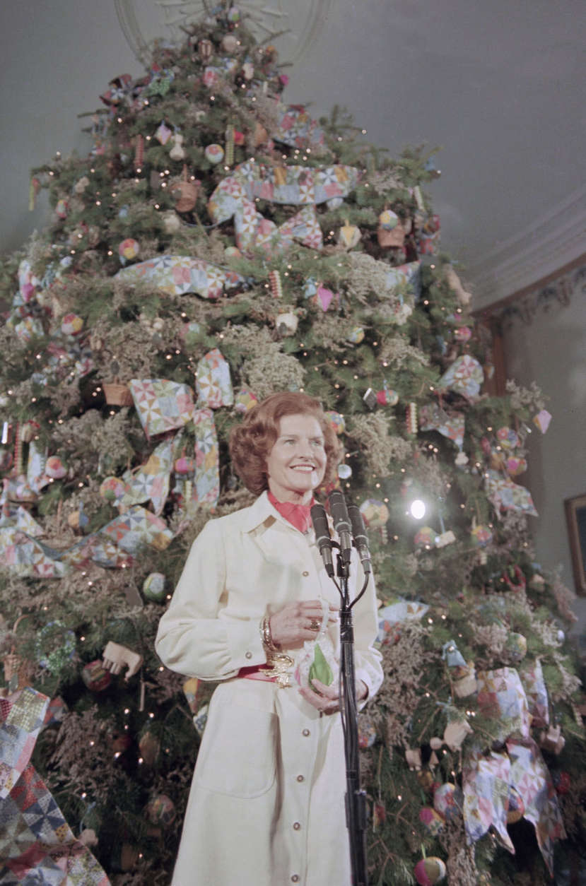 Betty Ford poses in front of the White House Christmas tree in Washington on Dec. 10, 1974. (AP Photo)