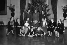 It was a family Christmas at White House (in Washington, D.C.) on Dec. 25, 1939 and above is the family portrait in the East Room.   In picture, the performing Johnny Boettiger, nine-month-old grand son of  President Franklin D. Roosevelt, is the cynosure of all eye seated, left to right: Mrs. Eleanor Roosevelt; Mrs. Sara Roosevelt,  president's mother; Mrs. Franklin Roosevelt, Jr., with Franklin III on lap; the president; Mrs. John Boettiger president's daughter Anna and her son, Johnny; Mrs. J.R. Roosevelt (President's sister-in-law); Mrs. Anne Roosevelt; wife of son John;  standing, Franklin, Jr. and John; John Boettiger on floor, Eleanor "Sistie" Dall; Diana Hopkins,  Commerce secretary's daughter; and Curtis "Bussie" Dall, Jr.        Only the families of Elliott and James were missing.  (AP Photo)