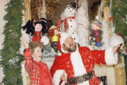 First Lady Nancy Reagan, left, and Santa, Dom DeLuise, throw some artificial snow in the air during a press preview of White House decorations, Monday, Dec. 14, 1987, Washington, D.C. The White House has been decorated according to the theme of A Musical Christmas. (AP Photo/Barry Thumma)