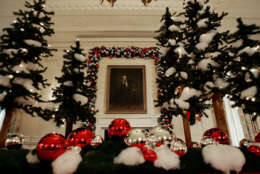 A portrait of Abraham Lincoln the East Room is surrounded by holiday decorations as First lady Laura Bush , not shown, hosted a media preview of the 2006 holiday decorations at the White House in Washington,Thursday, Nov. 30, 2006.  (AP Photo/Ron Edmonds)
