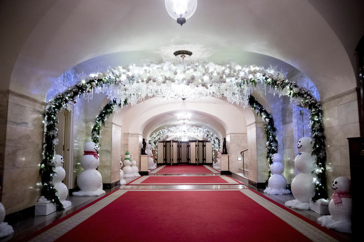 The Lower Cross Hall is decorated with "snowball" arches created from more than 6,000 ornaments and snowmen lining the corridor in the White House during a preview of the 2016 holiday decor, Tuesday, Nov. 29, 2016, in Washington. (AP Photo/Andrew Harnik)
