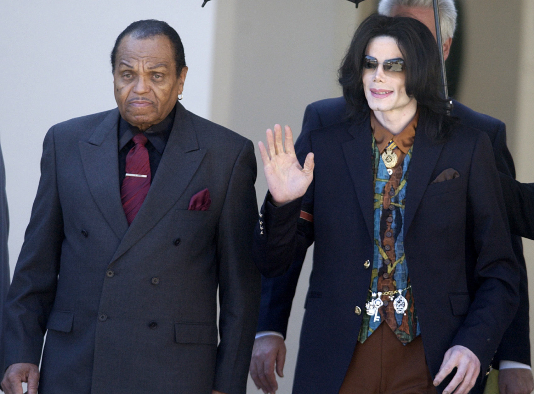 FILE - In this March 15, 2005 file photo, Pop star Michael Jackson leaves the Santa Barbara County Courthouse with his father, Joe, left, in Santa Maria, Calif., following a day of testimony in Jackson's trial on charges of child molestation. Jackson, 50, died in Los Angeles on Thursday, June 25, 2009. (AP Photo/Michael A. Mariant, file)