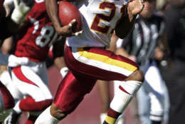 ** FILE ** In this Nov. 26, 2007 file photo, Washington Redskins safety Sean Taylor is chased by the Arizona Cardinals after Taylor made a first-quarter interception during an NFL football game  in Landover, Md.  There are tangible reminders of Sean Taylor at Redskins Park.  The plaque outside new head coach Jim Zorn's office, for example. Or the Pro Bowl safety's locker room stall, still arranged precisely as it was the day he died.   (AP Photo/Evan Vucci, File)