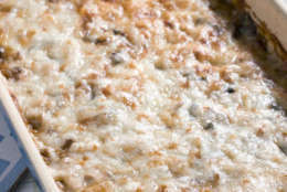 A cheesy baked lentils, rice and turkey casserole is seen in this Sept. 21, 2010 photo. Satisfy your appetite with healthy, protein rich ingredients and you may be on your way to losing weight. This casserole is full of low-fat proteins that will fill you up, not out.    (AP Photo/Larry Crowe)