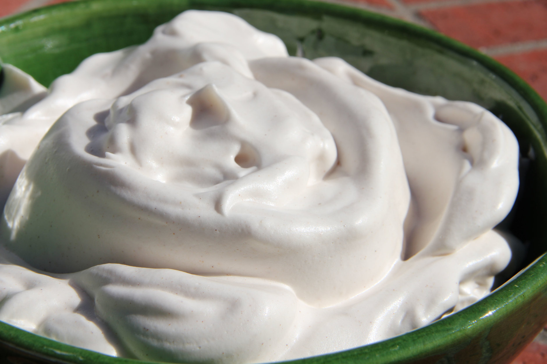 This Oct. 20, 2016 photo shows a natural, lower calorie whipped cream substitute in Coronado, Calif. It's made with the liquid leftover from the slow cooking of beans and legumes called "aquafaba" which can be whipped up into a pillowy fluff in minutes. This dish is from a recipe by Melissa d'Arabian. (Melissa d'Arabian via AP)