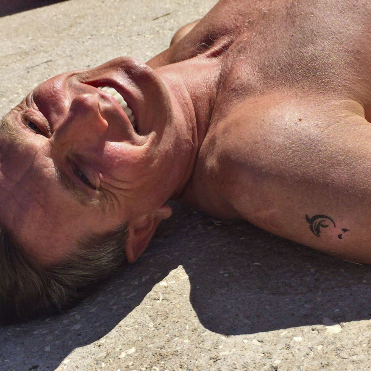 In this undated photo provided by the Office of the Slovenia's president and used on president's Instagram, Slovenia's president Borut Pahor, enjoys sunbathing on a beach in Pacug, Slovenia. Donald Trump may rule Twitter, but he's no match for his Slovenian counterpart on Instagram as Slovenia's president Borut Pahor has been actively using social media to get his message across since 2012. (Petra Arsic/Office of the Slovenia's President via AP)