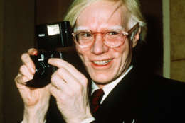 FILE - In this 1976 file photo, pop artist Andy Warhol smiles in New York. In the late 1970s, pop artist Andy Warhol and writer Truman Capote recorded dozens of hours of intimate conversations they planned to use as the basis for a Broadway play however, the two icons moved on to other projects, the tapes were forgotten and both men died. Director Rob Roth tracked down the tapes and adapted them for the play premiering Sunday, Sept. 10, 2017, in Cambridge, Mass. (AP Photo/Richard Drew, File)