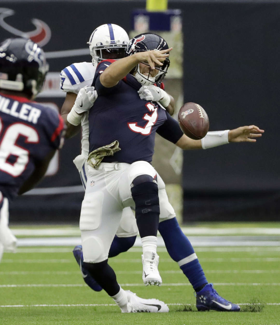 Houston Texans quarterback Tom Savage (3) is hit by Indianapolis Colts inside linebacker Jon Bostic (57) as he tries to throw during the first half of an NFL football game Sunday, Nov. 5, 2017, in Houston. (AP Photo/David J. Phillip)