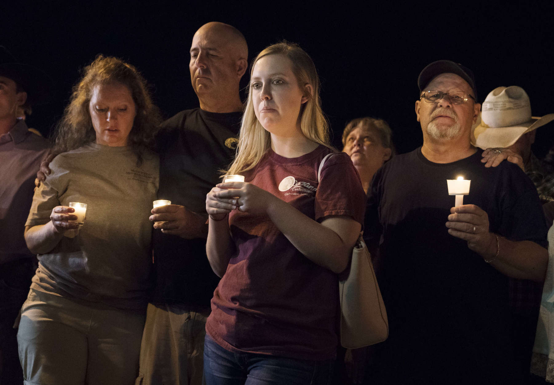 Mourners participate in a candlelight vigil held for the victims of a fatal shooting at the First Baptist Church of Sutherland Springs, Sunday, Nov. 5, 2017, in Sutherland Springs, Texas. (AP Photo/Darren Abate)