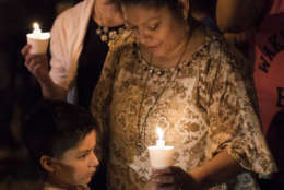 Mourners participate in a candlelight vigil held for the victims of a fatal shooting at the First Baptist Church in Sutherland Springs, Sunday, Nov. 5, 2017, in Sutherland Springs, Texas. A man opened fire inside of the church in the small South Texas community on Sunday, killing more than 20 people. (AP Photo/Darren Abate)