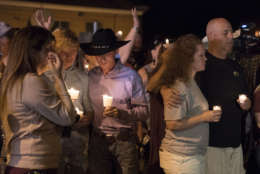 Mourners participate in a candlelight vigil held for the victims of a fatal shooting at the First Baptist Church of Sutherland Springs, Sunday, Nov. 5, 2017, in Sutherland Springs, Texas. (AP Photo/Darren Abate)