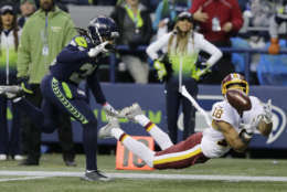 Washington Redskins wide receiver Josh Doctson, right, makes a diving catch ahead of Seattle Seahawks cornerback Shaquill Griffin, left, in the second half of an NFL football game, Sunday, Nov. 5, 2017, in Seattle. The Redskins won 17-14. (AP Photo/Stephen Brashear)