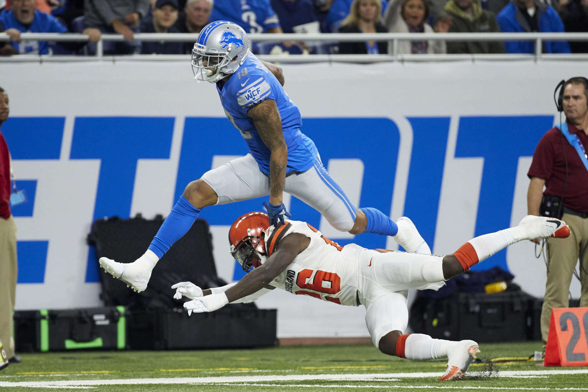 Detroit Lions wide receiver Kenny Golladay (19) leaps over Cleveland Browns strong safety Derrick Kindred (26) during an NFL football game, Sunday, Nov. 12, 2017, in Detroit. (AP Photo/Rick Osentoski)