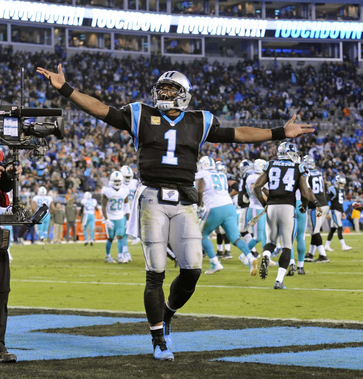 Carolina Panthers' Cam Newton (1) celebrates a touchdown pass against the Miami Dolphins in the second half of an NFL football game in Charlotte, N.C., Monday, Nov. 13, 2017. (AP Photo/Mike McCarn)