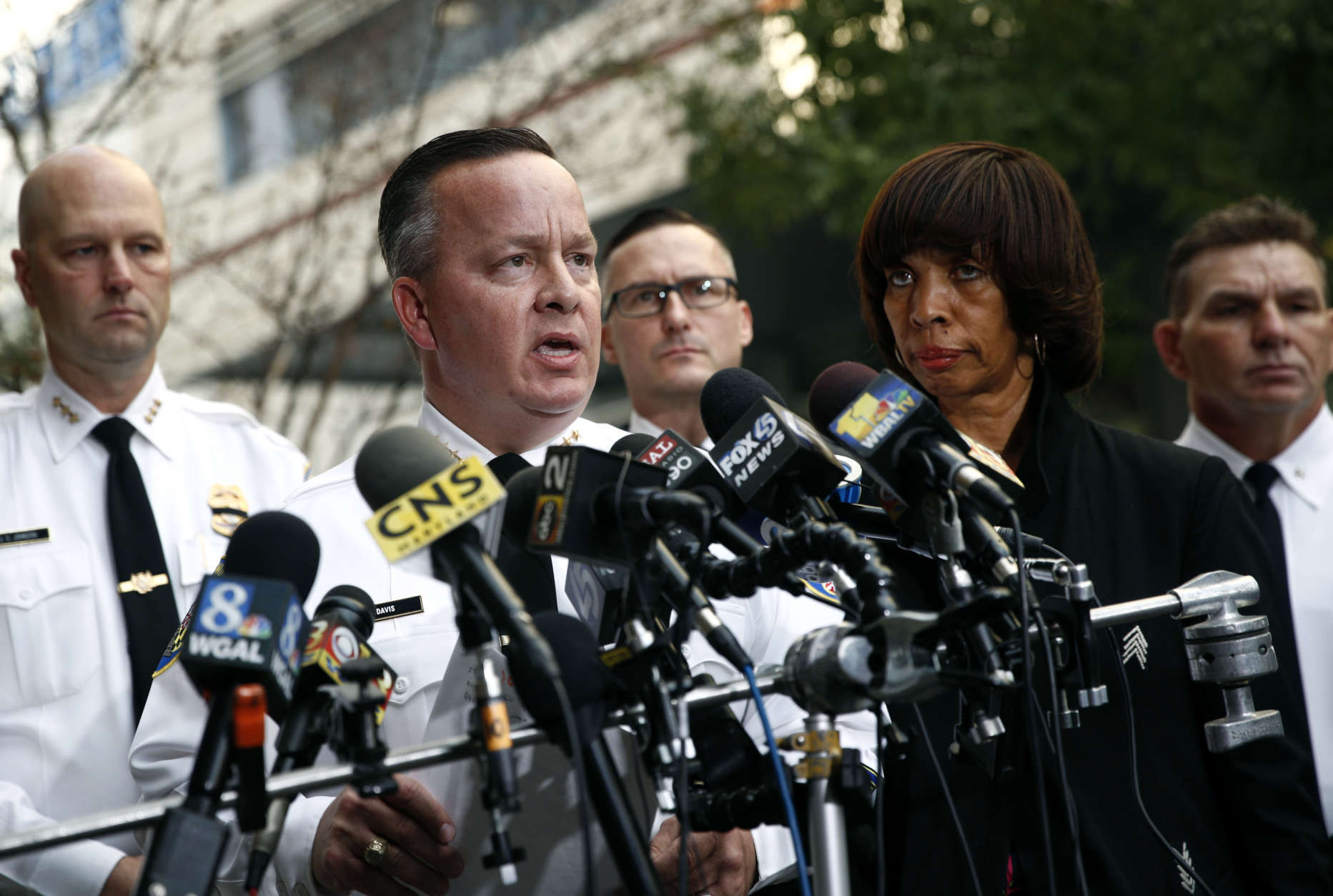 Baltimore Police Department Commissioner Kevin Davis, left, speaks alongside Mayor Catherine Pugh at a news conference outside the R Adams Cowley Shock Trauma Center in Baltimore, Thursday, Nov. 16, 2017, to announce the death of Det. Sean Suiter. Suiter was shot in the head Wednesday while working in a troubled area of the city grappling with high crime rates. (AP Photo/Patrick Semansky)
