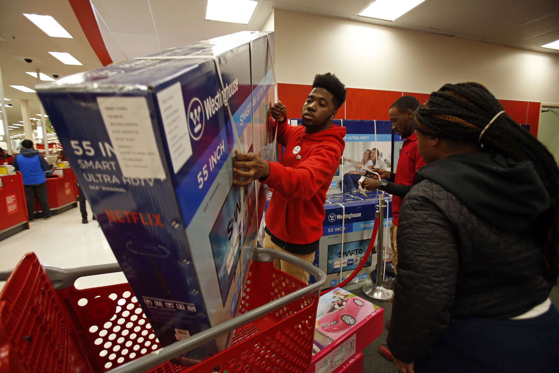 IMAGE DISTRIBUTED FOR TARGET - A Target team member assists a customer with a TV purchase on Thursday, Nov. 23, 2017, in Jersey City, N.J. (Adam Hunger/AP Images for Target)