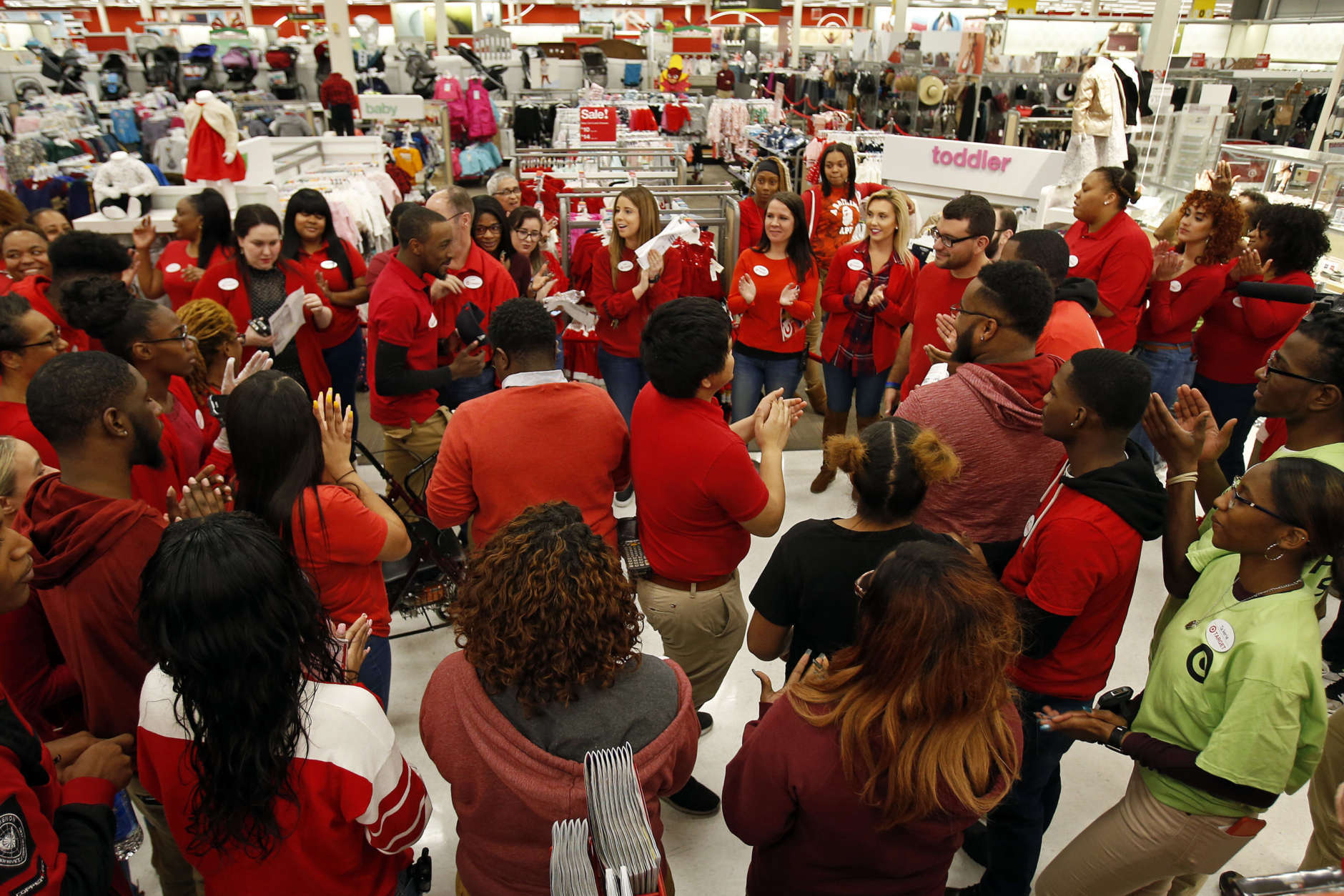 IMAGE DISTRIBUTED FOR TARGET - A Target team gets ready to welcome shoppers on Thanksgiving day, Thursday, Nov. 23, 2017, in Jersey City, N.J. (Adam Hunger/AP Images for Target)