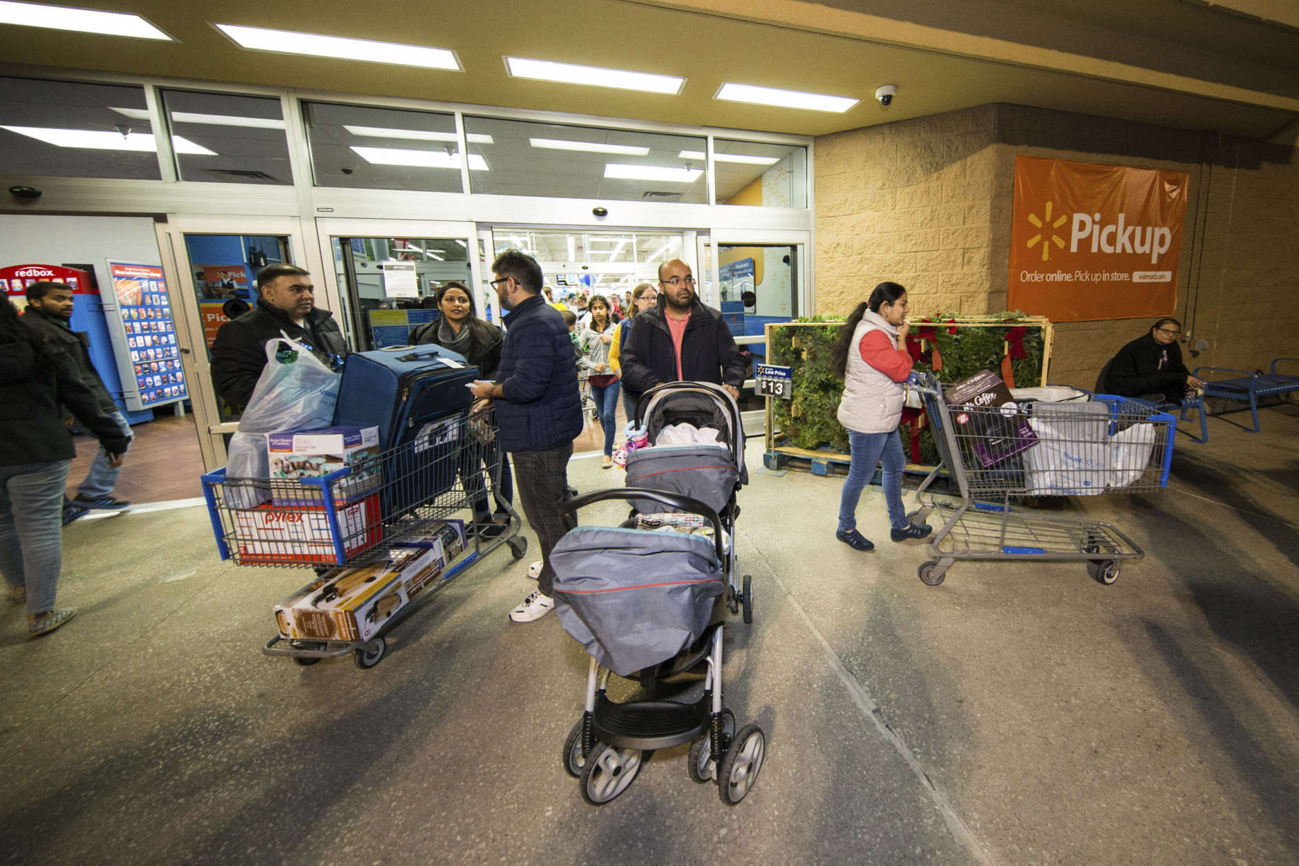 IMAGE DISTRIBUTED FOR WALMART - Walmart customers secured Black Friday deals on Thursday, Nov. 23, 2017 in Bentonville, Ark. This year, Walmart offered hundreds of deals online and in stores on TVs, smart home devices, and other gadgets. (Gunnar Rathbun/AP Images for Walmart)