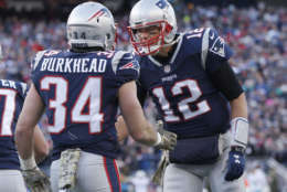 New England Patriots quarterback Tom Brady, right, celebrates his touchdown pass to running back Rex Burkhead during the first half of an NFL football game against the Miami Dolphins, Sunday, Nov. 26, 2017, in Foxborough, Mass. (AP Photo/Michael Dwyer)