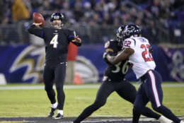 Baltimore Ravens punter Sam Koch (4) throws a pass on a fake punt play in the first half of an NFL football game against the Houston Texans, Monday, Nov. 27, 2017, in Baltimore. (AP Photo/Nick Wass)