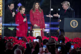 President Donald Trump and first lady Melania Trump, react as they light the 2017 National Christmas Tree during the National Christmas Tree lighting ceremony at the Ellipse near the White House in Washington, Thursday, Nov. 30, 2017. With the president and the first lady are hosts for the event, Kathie Lee Gifford and actor Dean Cain. (AP Photo/Andrew Harnik)