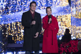 Hosts Kathie Lee Gifford and actor Dean Cain speak during the lighting ceremony for the 2017 National Christmas Tree on the Ellipse near the White House, Thursday, Nov. 30, 2017, in Washington. (AP Photo/Andrew Harnik)
