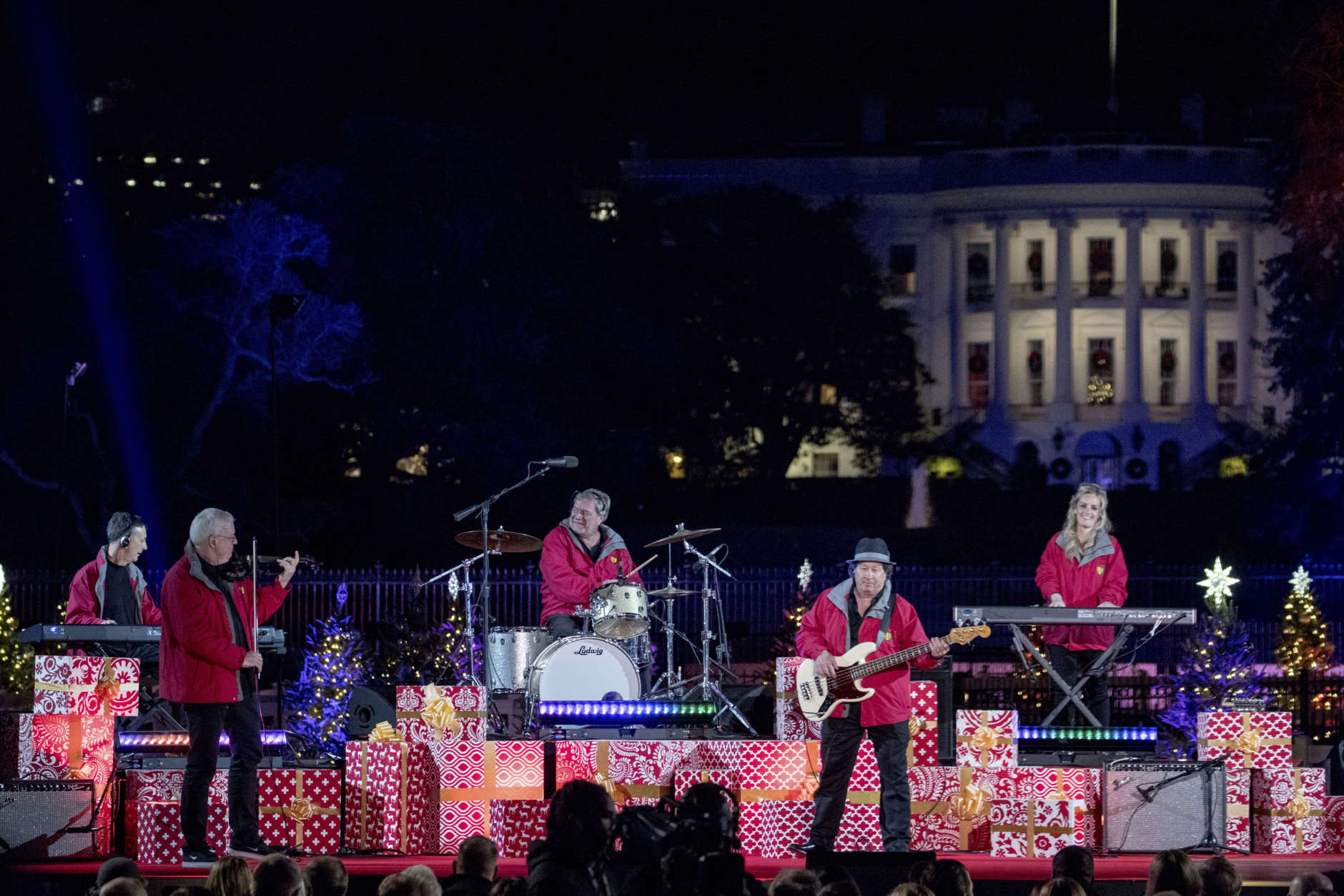 Chip Davis and the Mannheim Steamroller perform during the lighting ceremony for the 2017 National Christmas Tree on the Ellipse near the White House, Thursday, Nov. 30, 2017, in Washington. (AP Photo/Andrew Harnik)