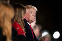 President Donald Trump and first lady Melania Trump watch performances during the National Christmas Tree lighting ceremony at the Ellipse near the White House in Washington, Thursday, Nov. 30, 2017. (AP Photo/Manuel Balce Ceneta)