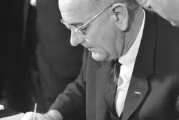 President Lyndon Johnson signing Clean Air Act in Washington on December 17, 1963 . (AP Photo/Henry Burroughs)