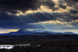 In this March 19, 2010 photo, sun rays filter through clouds over 5,267-foot Mount Katahdin in Maine's Baxter State Park. Last year, starting in March, more than 1400 hikers set off from Georgia's Springer Mountain with the goal of reaching the summit of Mount Katahdin, the northern terminus of the 2,100-mile Appalachian Trail. About 350 hikers completed the northbound hike, according the the Appalachian Trail Conservancy. (AP Photo/Robert F. Bukaty)