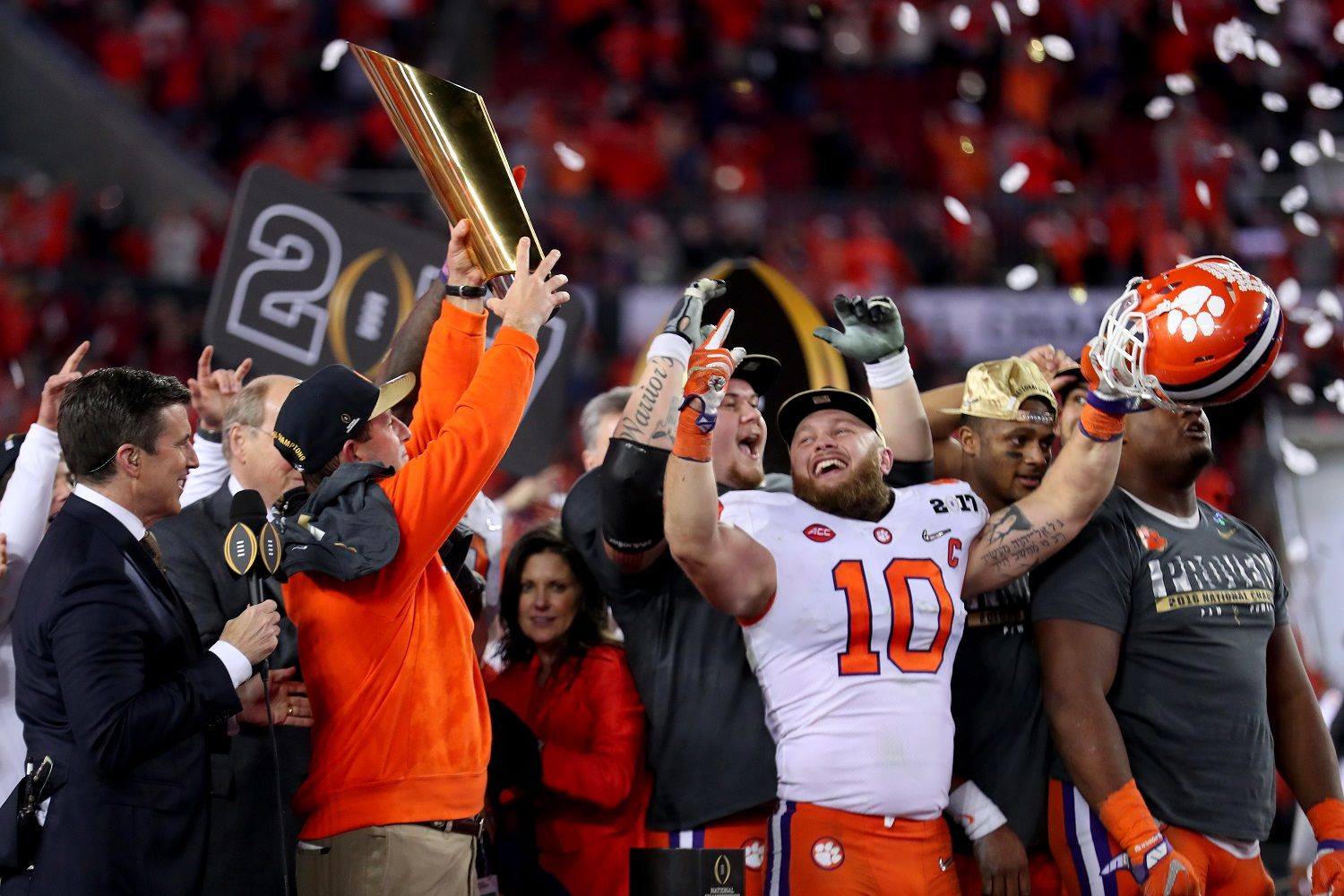 TAMPA, FL - JANUARY 09:  Head coach Dabo Swinney of the Clemson Tigers (L) and linebacker Ben Boulware #10 celebrate after defeating the Alabama Crimson Tide 35-31 to win the 2017 College Football Playoff National Championship Game at Raymond James Stadium on January 9, 2017 in Tampa, Florida.  (Photo by Tom Pennington/Getty Images)