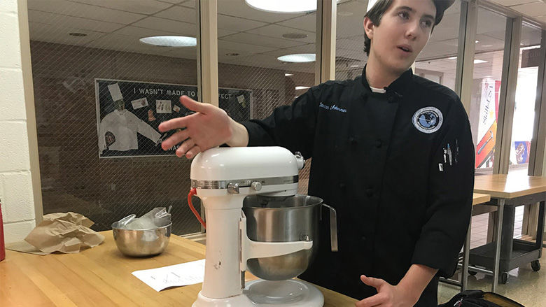 Caedan Ackerman, a student in the culinary arts program, bakes donuts during his free lab on Thursday, November 2, 2017. (Georgia Slater/Capital News Service)