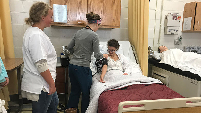 Students in the honors academy of health program learn and practice how to test vitals on one another on Thursday, November 2, 2017. (Georgia Slater/Capital News Service)