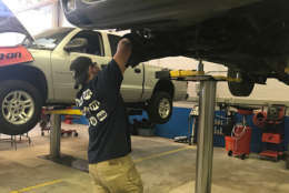 CJ Catner, a student in the auto technology program who has already received eight certifications in his field, continues to hone in his skills working on vehicles on Thursday, November 2, 2017. (Georgia Slater/Capital News Service)