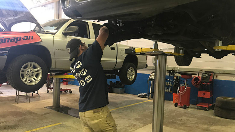 CJ Catner, a student in the auto technology program who has already received eight certifications in his field, continues to hone in his skills working on vehicles on Thursday, November 2, 2017. (Georgia Slater/Capital News Service)